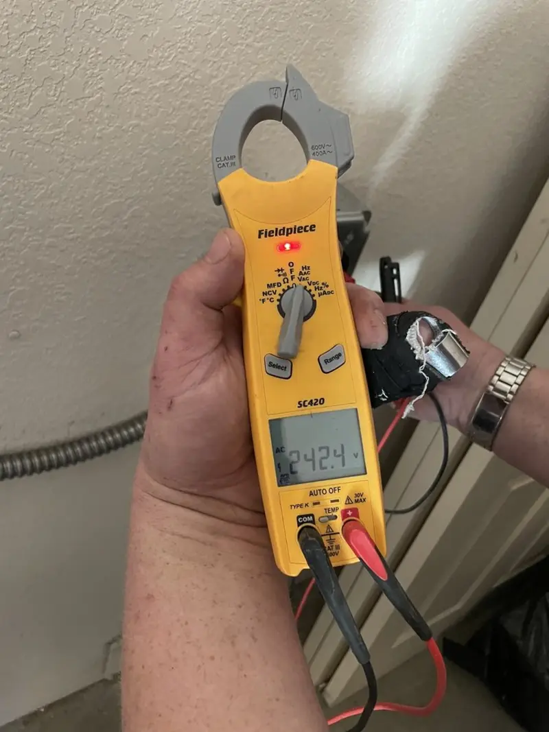 Voltage testing with clamp meter during Electrical Installation Services in South Sioux City